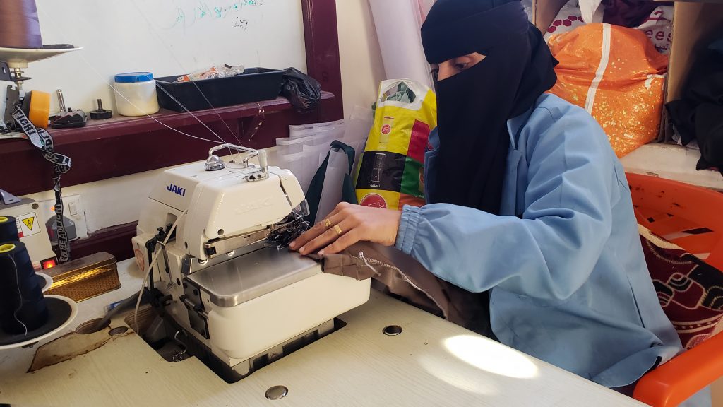 Woman in vocational sewing training for women's economic empowerment in Yemen, supported by Vision Hope