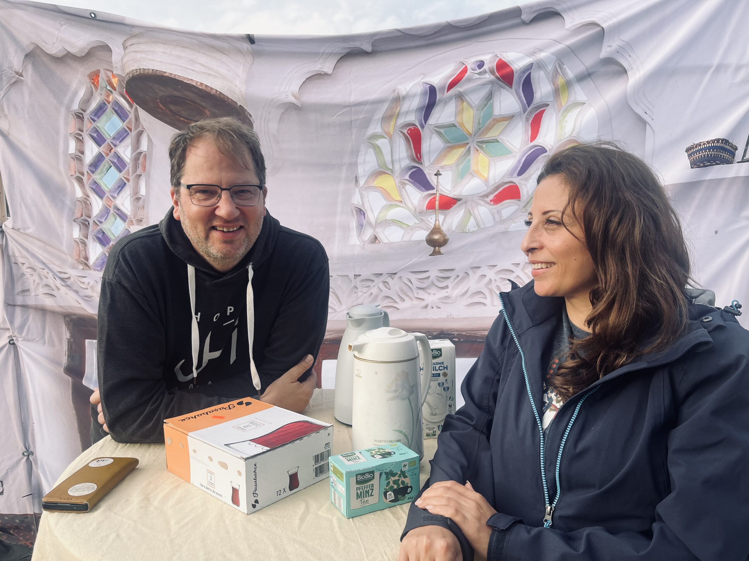 Rainer Weber, Board Member, and Susan Younes, Administration Specialist, in conversation at Vision Hope International